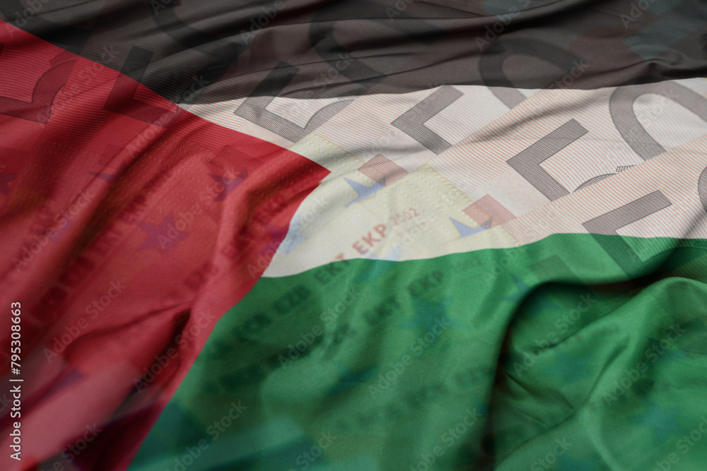 waving colorful national flag of palestine on a euro money banknotes background. finance concept.