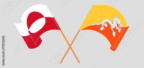 Crossed and waving flags of Greenland and Bhutan