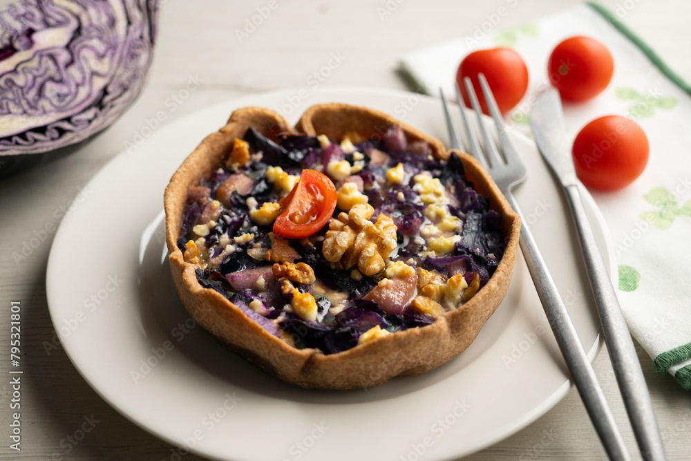 French quiche with red cabbage and vegetables. Traditional French recipe. French quiche with red cabbage and vegetables. Traditional French recipe.