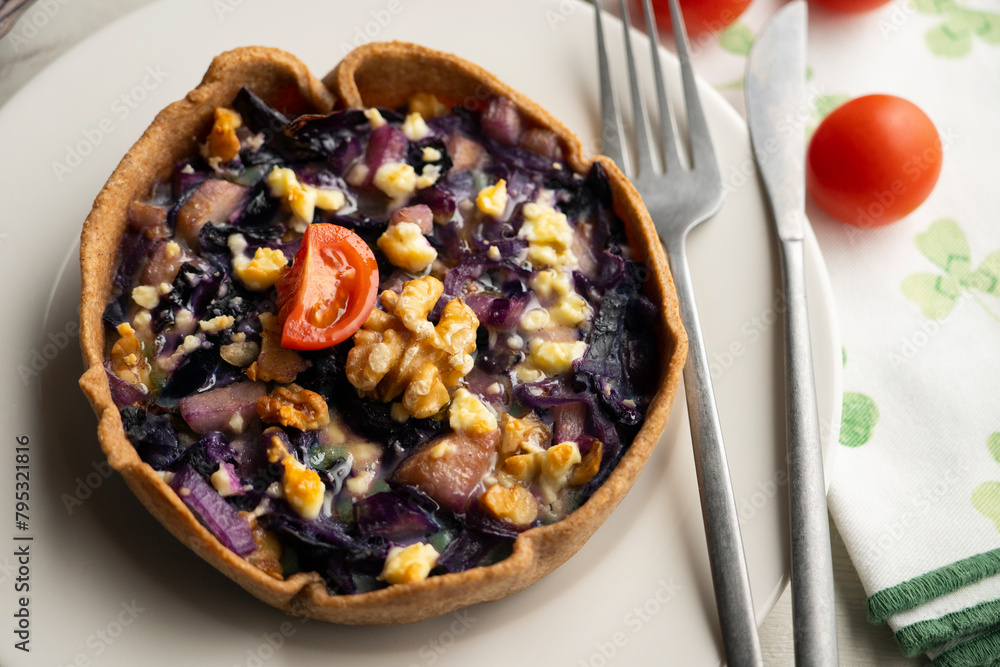 French quiche with red cabbage and vegetables. Traditional French recipe. French quiche with red cabbage and vegetables. Traditional French recipe.