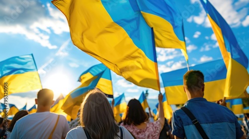 People of Ukraine on demostration holding ukrainian flags on sunny day Generative AI illustration in support of Ukraine and against the war with Ukrainian flags and crowds of people in the background photo