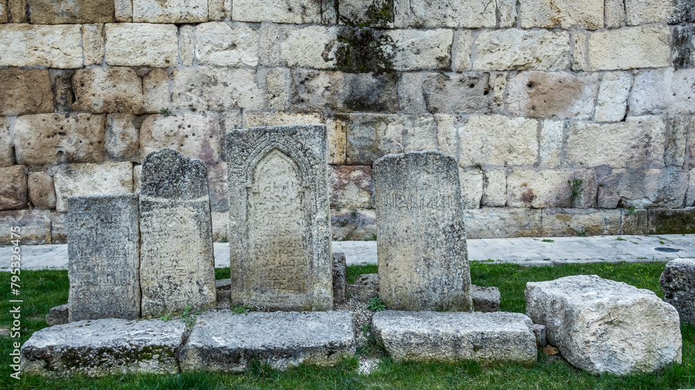 Ancient tombstones near the fortress wall. It is a monument of ancient Persian fortification architecture. History and religion. Ancient tombstones near the fortress wall. It is a monument of ancient Persian fortification architecture. History and religion.
