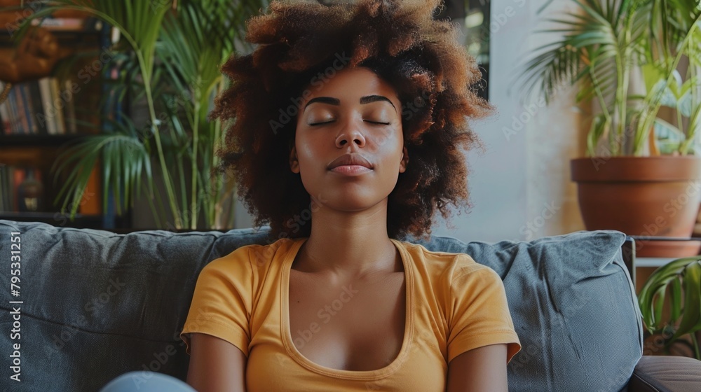 Depicting the concept of mental health, showing a woman sitting on the couch and practicing calming breathing exercises after a panic attack. Depicting the concept of mental health, showing a woman sitting on the couch and practicing calming breathing exercises after a panic attack.