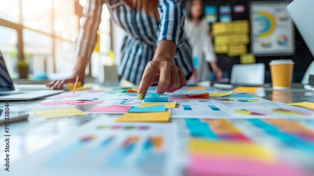 Fototapeta premium Professionals brainstorming ideas, strategizing, and problem-solving in a meeting, representing the challenges and opportunities of entrepreneurship and business.