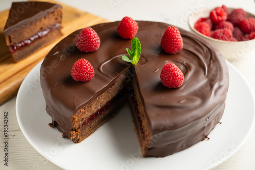 Chocolate Sachertorte with raspberry jam filling.