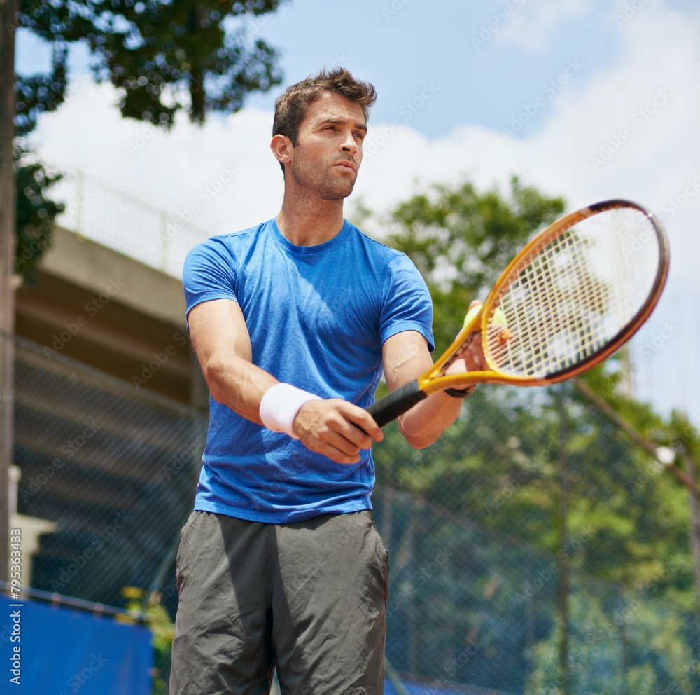Man, racket and serve in outdoor tennis match, game and court for competition or practice. Male person, athlete and ready for training or exercise, workout and hobby for action and play fitness