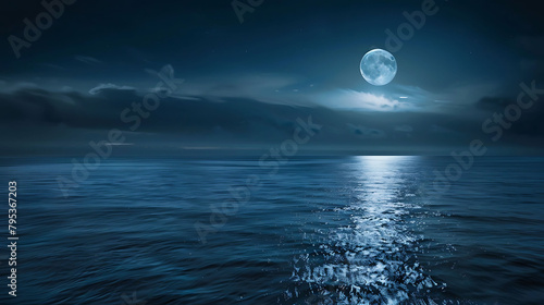 a serene ocean scene with a full moon shining over calm blue waters, reflecting the dark blue sky a photo