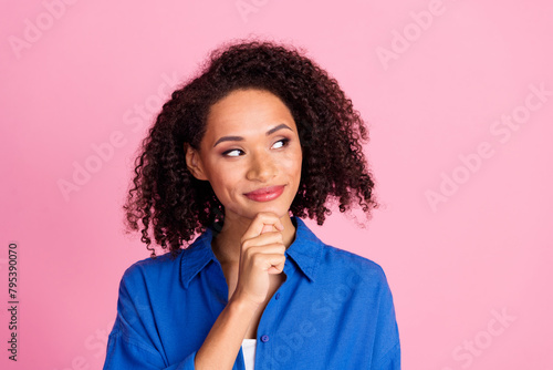 Photo of charming lovely pretty woman wear blue trendy clothes arm chin look empty space isolated on pink color background