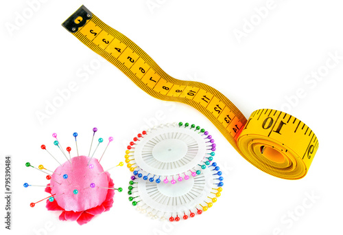 Measuring tape, sewing pinsand pincushion isolated on white. There is free space for text. Collage. photo