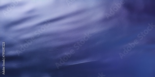 Indigo foil metallic wall with glowing shiny light, abstract texture background blank empty with copy space 