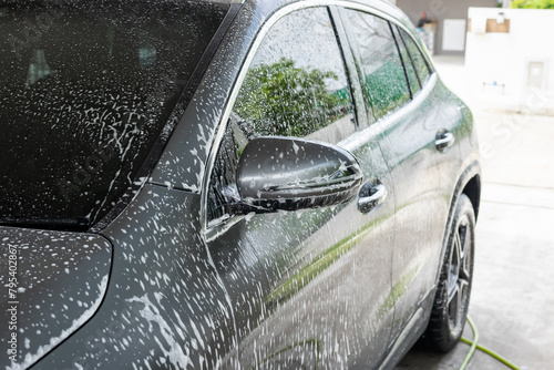 car cleaning and washing with foam soap © Piman Khrutmuang