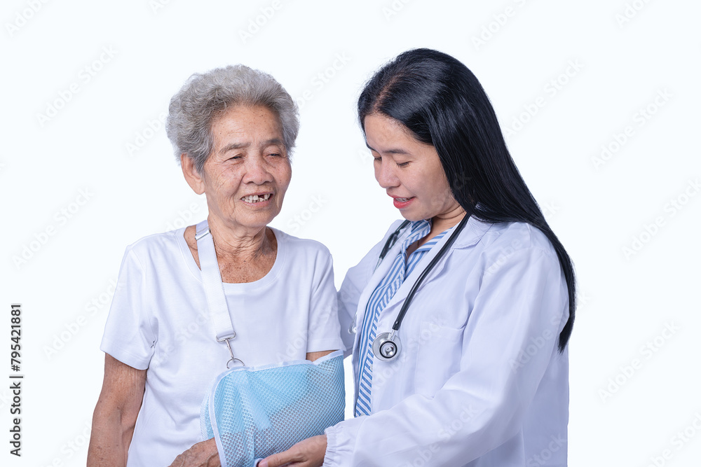 Asian female doctor helping the senior patient with a broken arm Look after it closely. medical health care concept injury treatment on a white background. Asian female doctor helping the senior patient with a broken arm Look after it closely. medical health care concept injury treatment on a white background.
