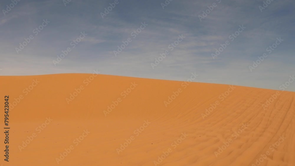 POV driving car through Erg Chebbi sand dunes of Sahara desert in southeastern Morocco