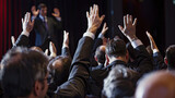 An image of a company CEO giving high-fives to employees as they celebrate achieving a top place in industry rankings