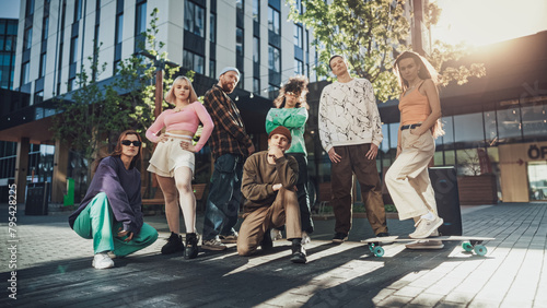 Vibrant Group Of Young Adults Showcasing Diverse Street Styles And Dynamic Poses In An Urban Setting  Reflecting Youth Culture  Friendship  And The Joy Of Dance Under The Afternoon Sun.