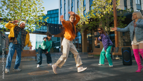 Vibrant Outdoor Scene Capturing A Diverse Group Of Young Adults Joyfully Dancing In An Urban Setting, Showcasing A Mix Of Modern And Street Dance Styles, Emphasizing Friendship And Cultural Diversity.