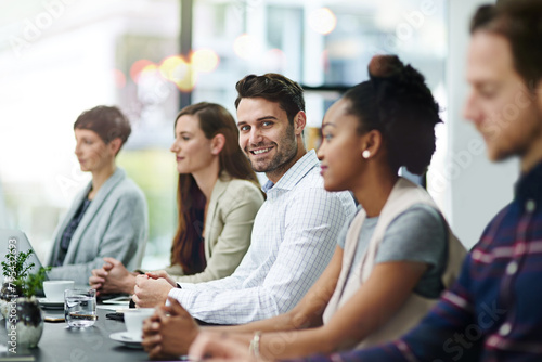 Teamwork  business people and meeting in office for conference  seminar or workshop on corporate training. Lens flare  diversity and group of employees for professional  onboarding or planning