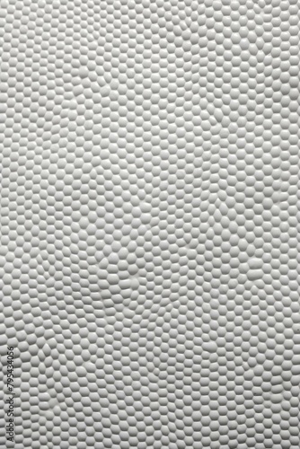 b'White texture resembling a basketball surface'