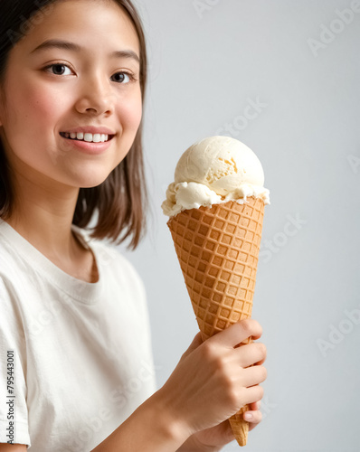 girl holding a ice cream in hand