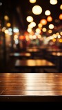 b'Empty wooden table with blurred background of restaurant with hanging lights'