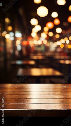 b'Empty wooden table with blurred background of restaurant with hanging lights' © Adobe Contributor