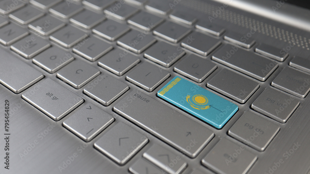 Keyboard with Kazakhstan flag on the enter button, represents cyber attack, learning language Keyboard with Kazakhstan flag on the enter button, represents cyber attack, learning language