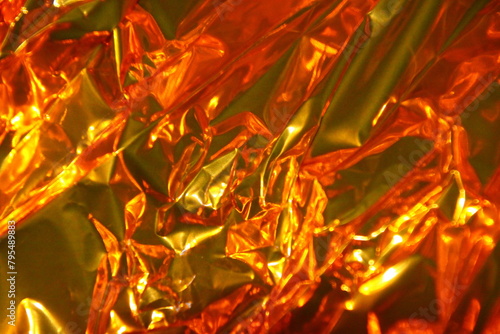 close up of crumpled golden, red, yellow paper, background,