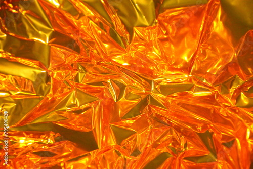 close up of crumpled golden, red, yellow paper, background,