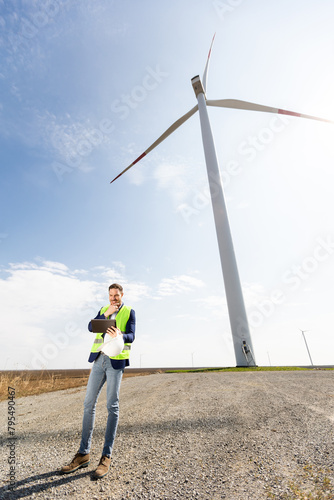 Confident Engineer Overseeing Renewable Energy Project at Wind Farm