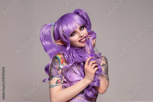 Portrait of beautiful expressive young woman in fairy/elf cosplay