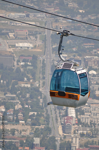 Aerial view of cable car on Vodno mountain and background of capital Skopje