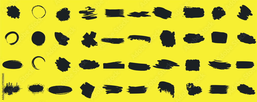 Abstract black brush strokes and shapes on a yellow canvas, featuring a variety of lines and forms, from circular and oval to rectangular and irregular Abstract black brush strokes and shapes on a yellow canvas, featuring a variety of lines and forms, from circular and oval to rectangular and irregular