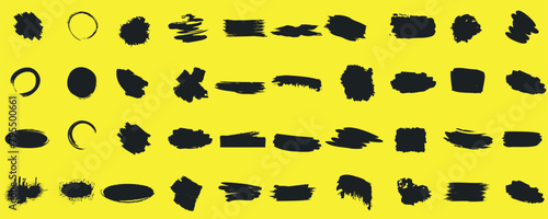 Abstract black brush strokes and shapes on a yellow canvas, featuring a variety of lines and forms, from circular and oval to rectangular and irregular