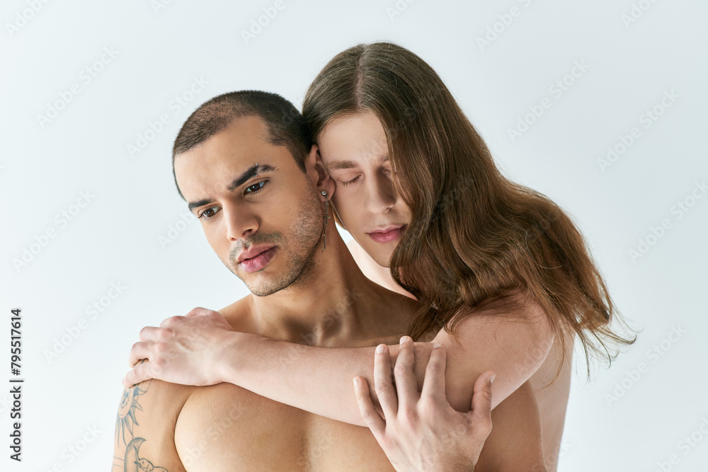A gay couple joyfully embraces each other. A gay couple joyfully embraces each other.