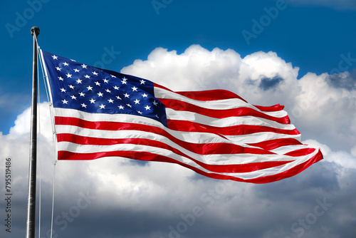 American flag on blue sky with beautiful clouds