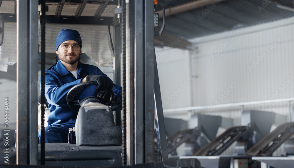 Portrait young man worker driver of forklift on industry factory, Warehouse of food plant