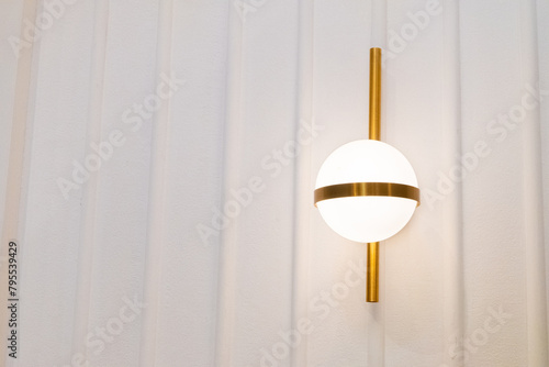 Modern gold lamp on wall for home decor,Interior design of dining room or living room. photo