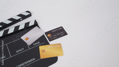 Credit cards and clapper board on white background.