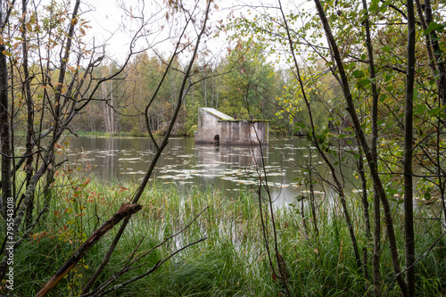 old building in a lake in the forest, Finland