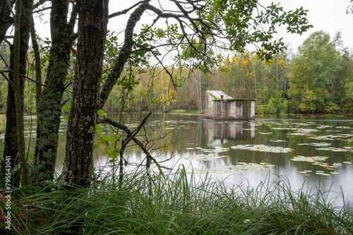 old building in a lake in the forest, Finland