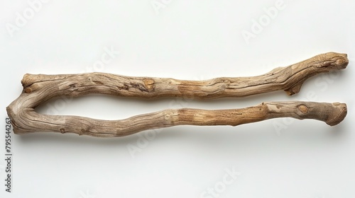   Two drifting wood fragments atop a pristine white backdrop Behind them, an untarnished white wall
