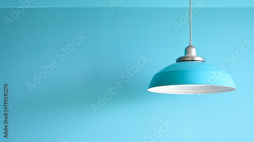  A blue ceiling lamp suspends above a room with blue walls, while a separate blue ceiling light completes the space's cohesive color scheme