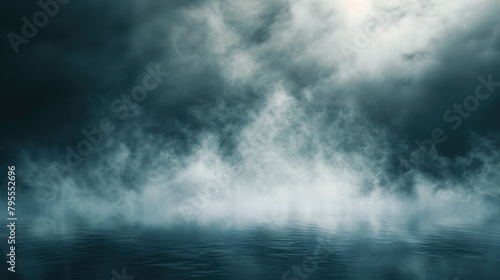 A misty, cloudy sky with a body of water in the foreground. The water appears to be calm and still, with a foggy mist hovering over it