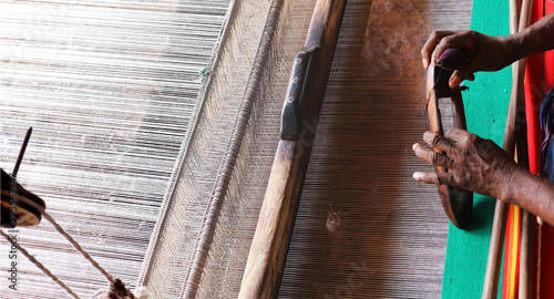 Handloom weaver in India working in her loom
