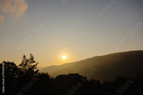 Wallpaper Mural Sun setting over distant mountains Torontodigital.ca