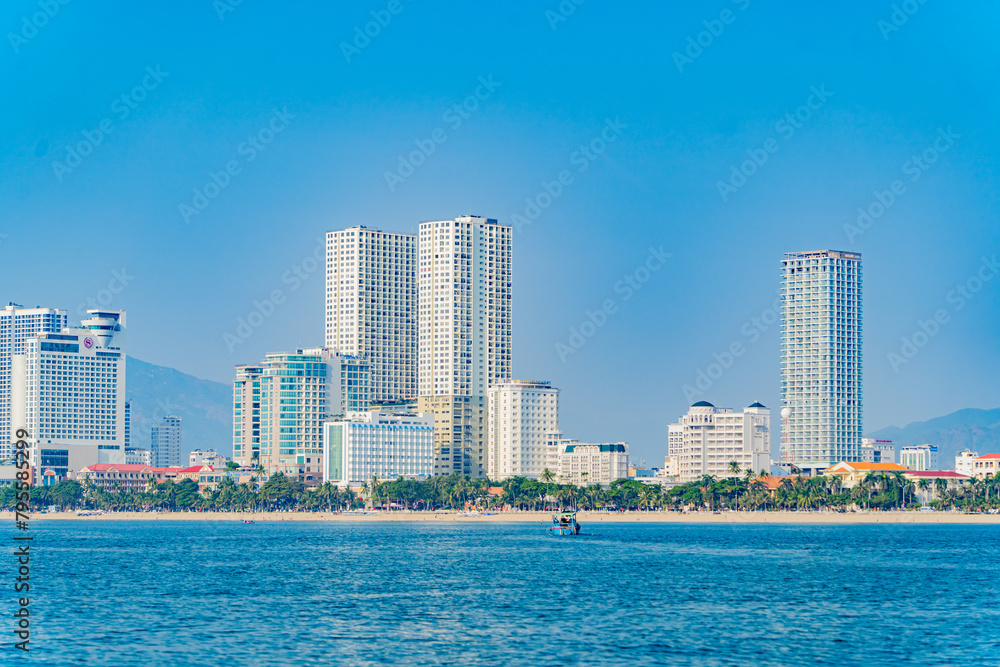 The city is from a distance from the sea.
Nha Trang city in Vietnam. View of the city from the sea. The city is from a distance from the sea.
Nha Trang city in Vietnam. View of the city from the sea.