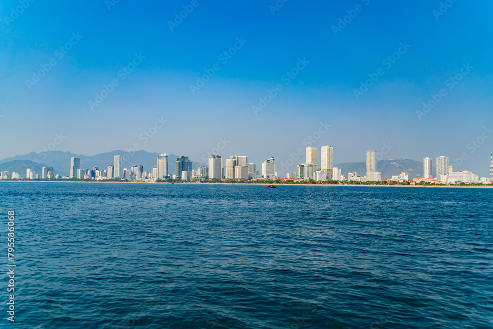 The city is from a distance from the sea.
Nha Trang city in Vietnam. View of the city from the sea.