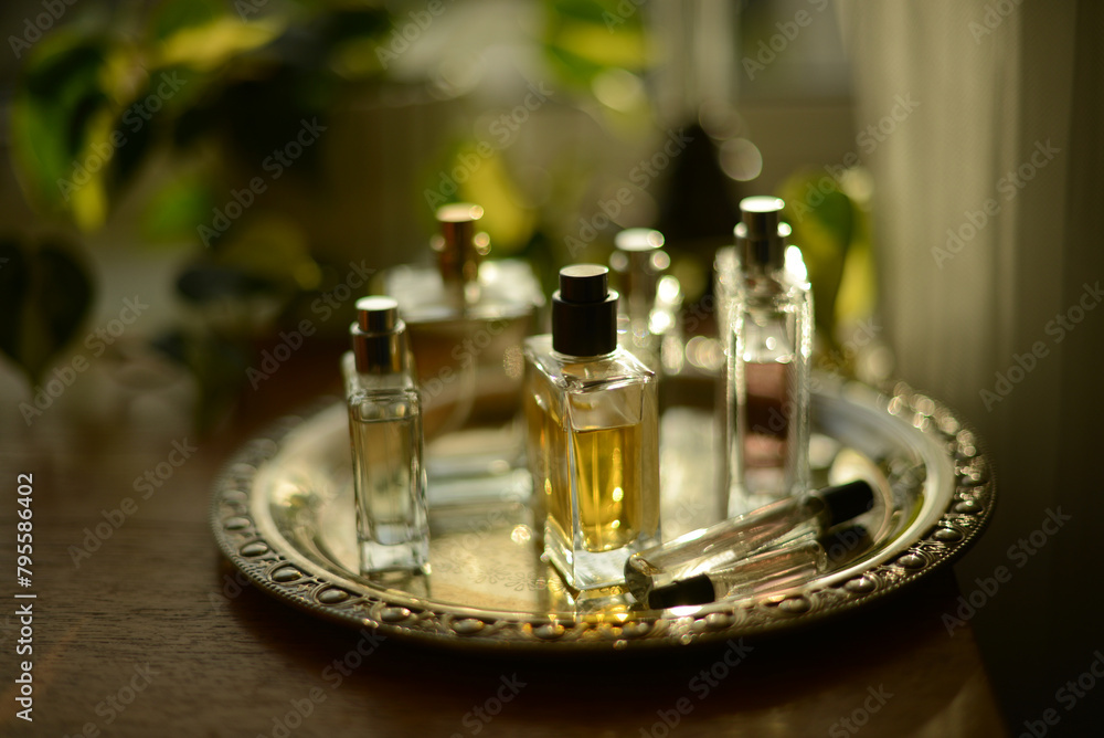perfume bottles on a silver tray perfume bottles on a silver tray