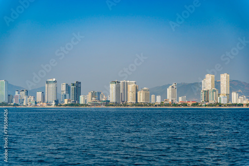 The city is from a distance from the sea.
Nha Trang city in Vietnam. View of the city from the sea.