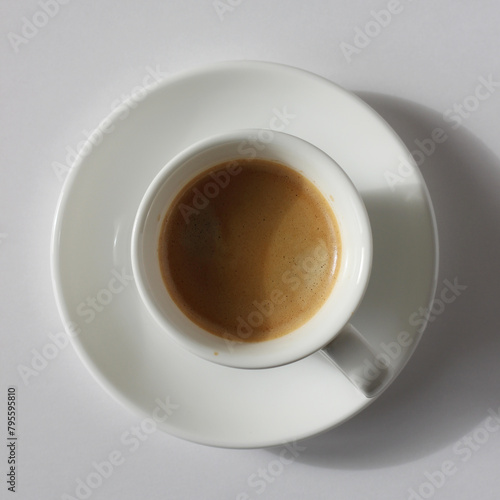 Espresso Shot with Crema Foam Closeup. Fresh Coffee Top View on White Background.